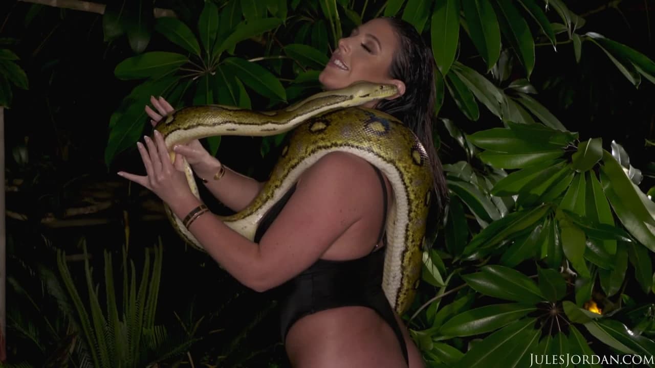 Angela White playing with a big snake