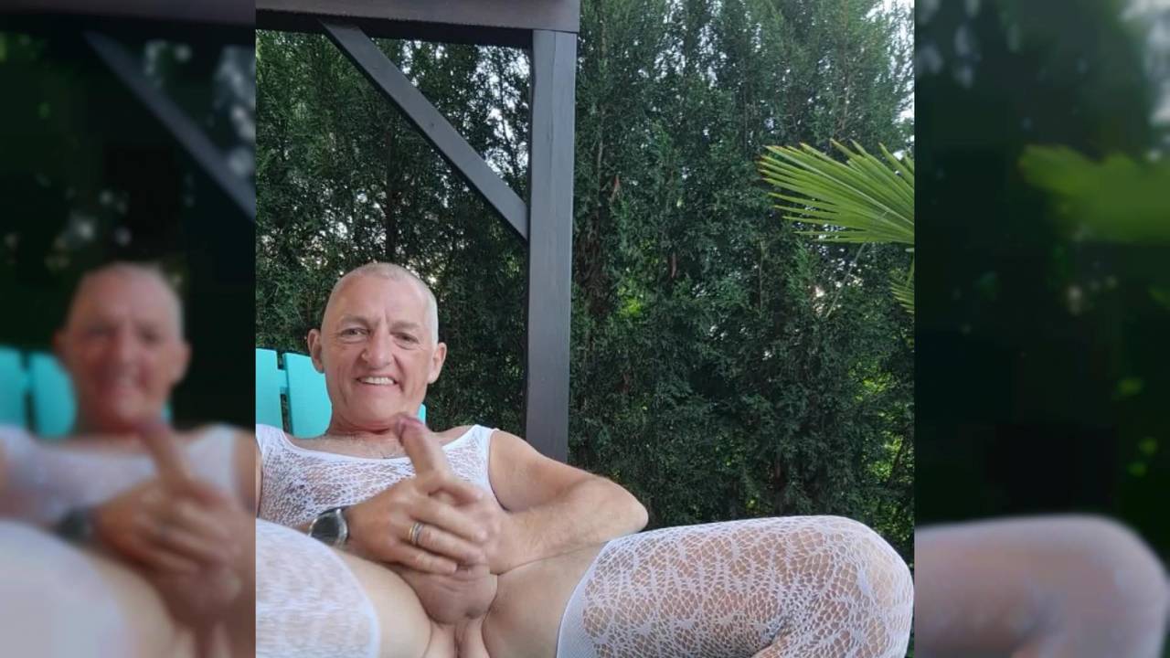 Old guy in a lace outfit is getting his cock hard outside