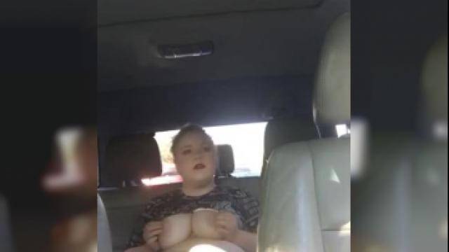 Masturbating on the back seat with her toy