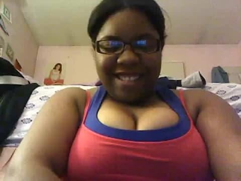 Black amateur chick shows her tits