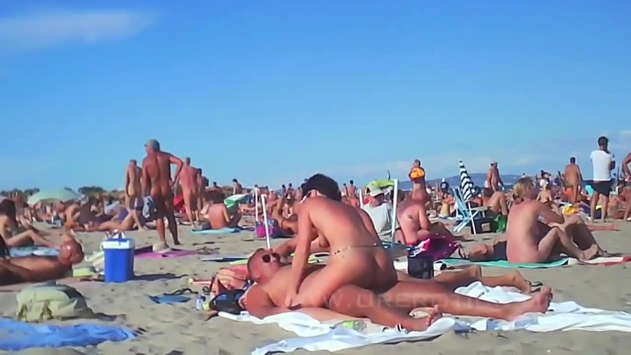 A crazy gangbang in the middle of the beach