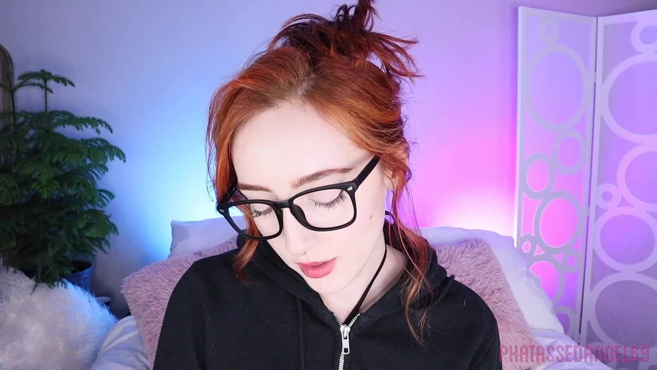 Pretty redhead sucks on her new toy