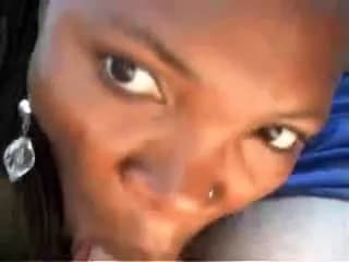 Black whore is sucking cock in a car